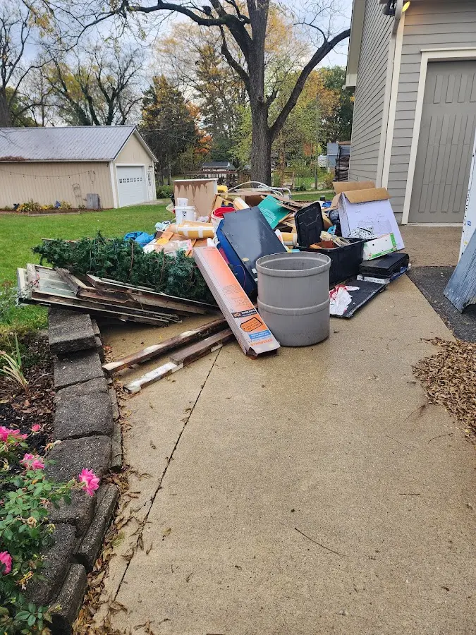 Dumpster being loaded with debris for 12 Yard Dumpster Rental in Lago Vista